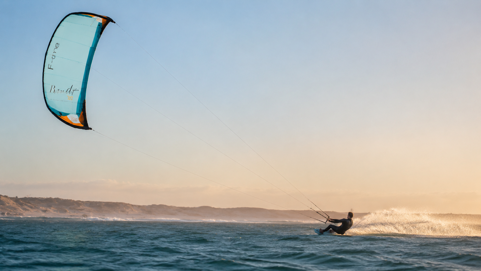 Kitesurfer jumping a wave under the Ice Lagoon kite